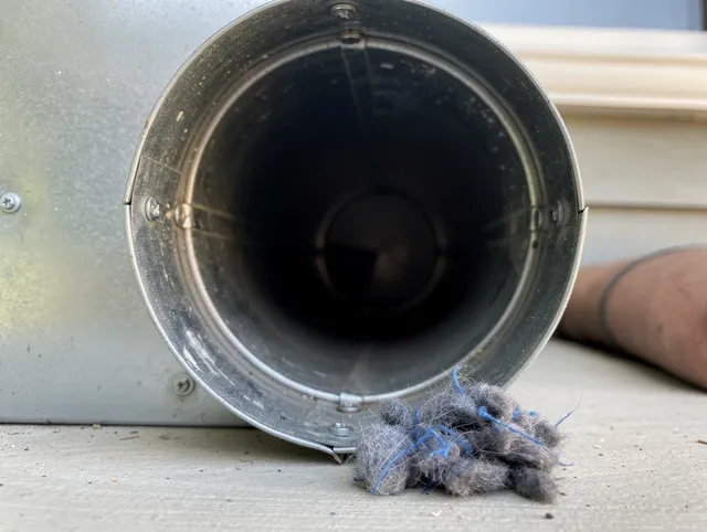 Fort Carson Dryer Vent Cleaning technician using specialized equipment to clear severe dryer vent blockage in Fort Carson